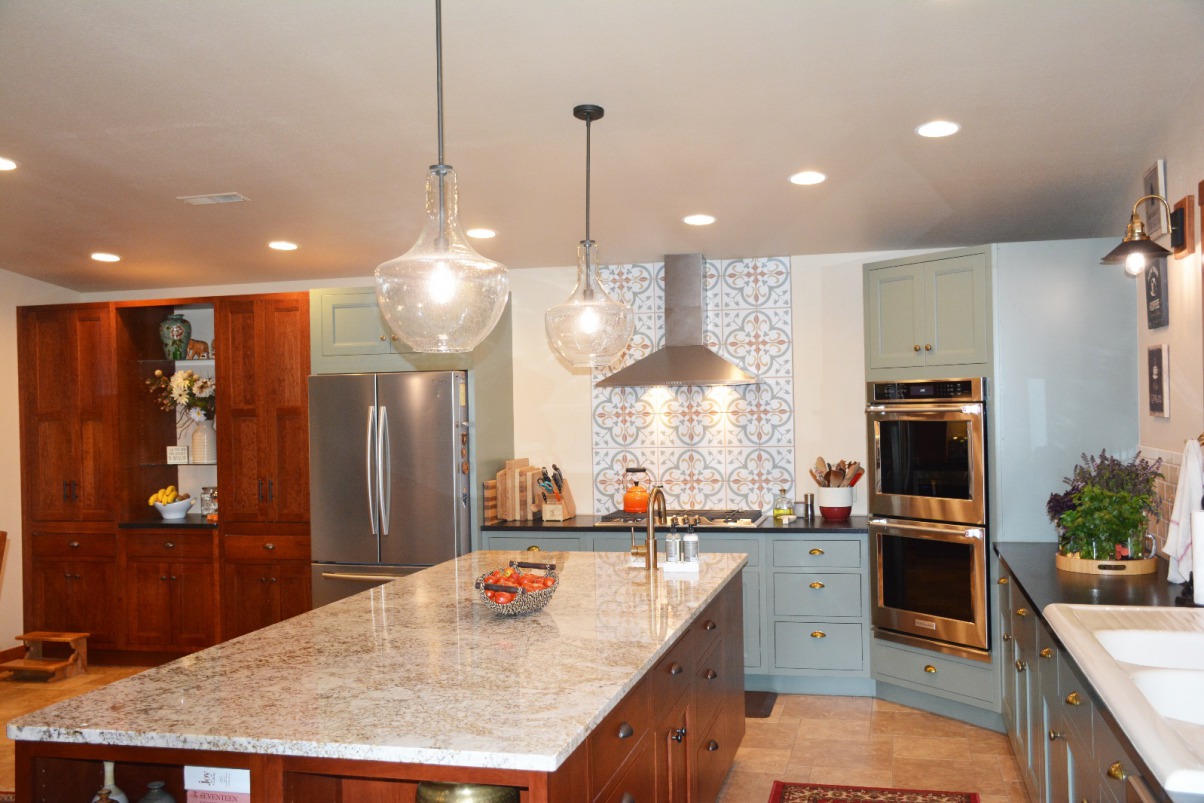 Notice her gorgeous backsplash as well as the uniquely placed angled wall oven. 